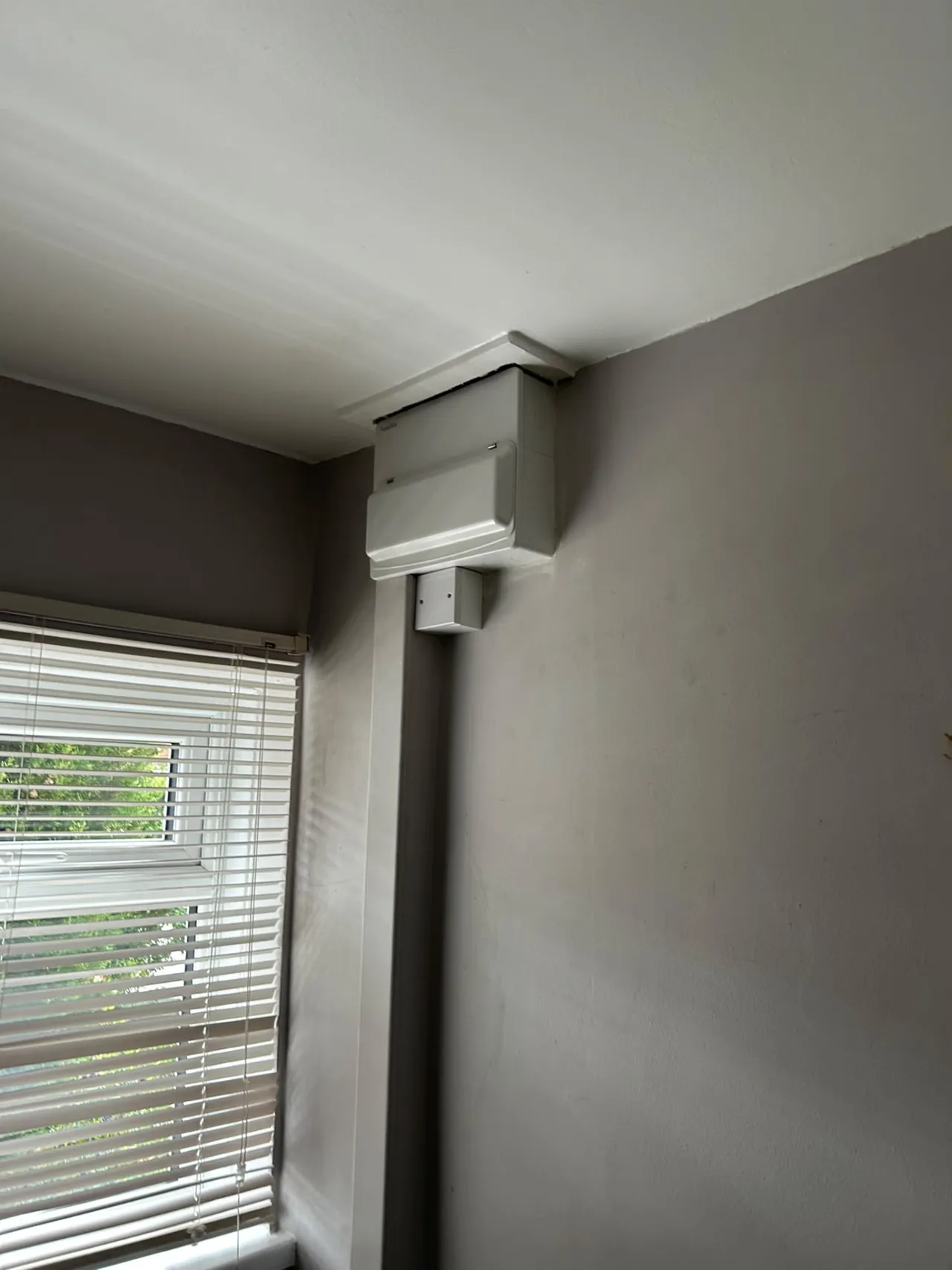Enclosed consumer unit installation with neat cable trunking in a domestic room
