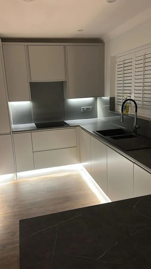 Modern kitchen with LED under-cabinet and plinth lighting