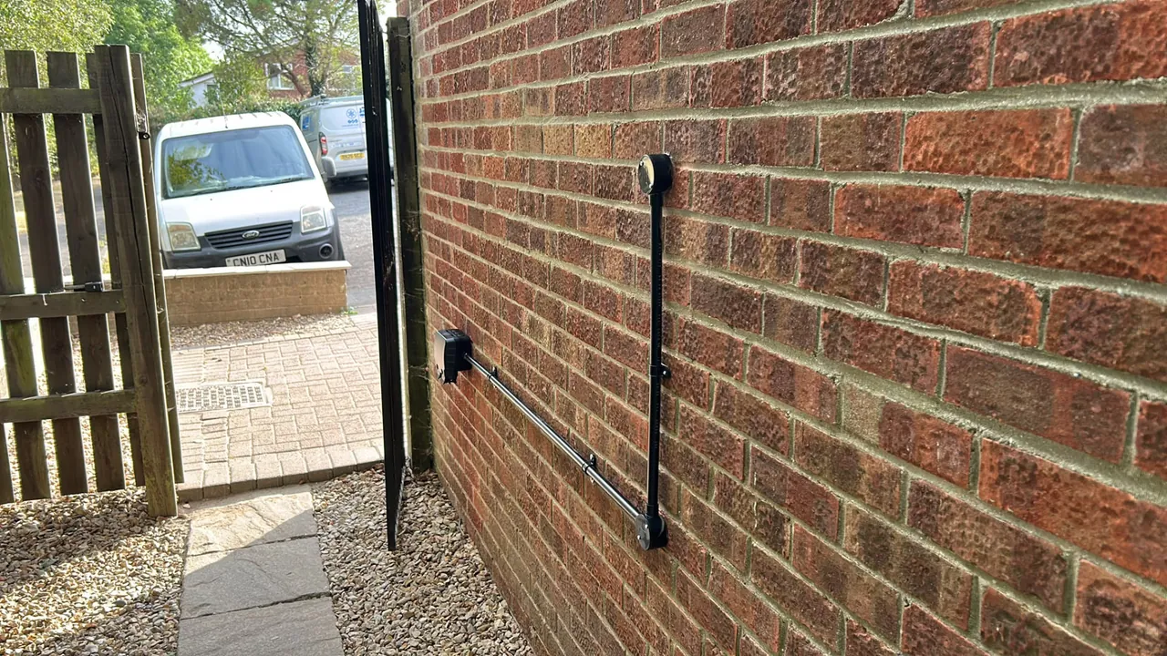Weatherproof outdoor socket installed on an exterior brick wall