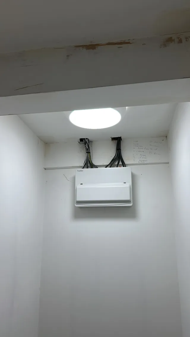 Consumer unit replacement mounted high on a freshly painted wall