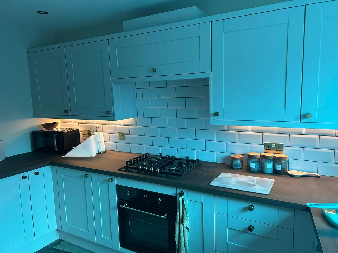Kitchen under-cabinet LED strip lighting above worktops